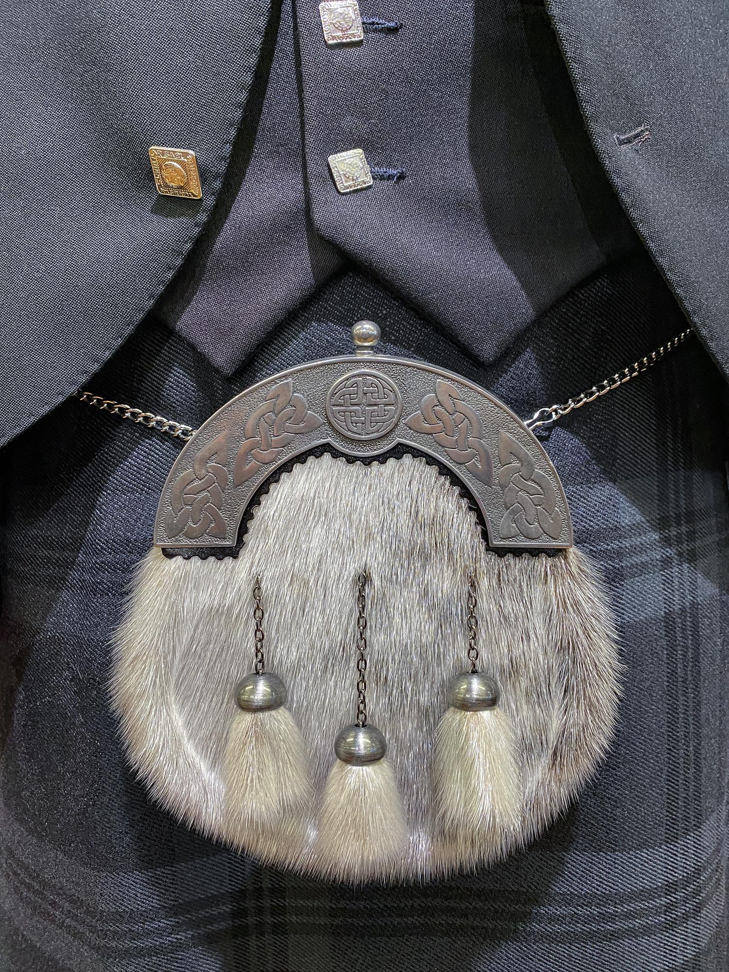 Embroidered crest on wool jacket